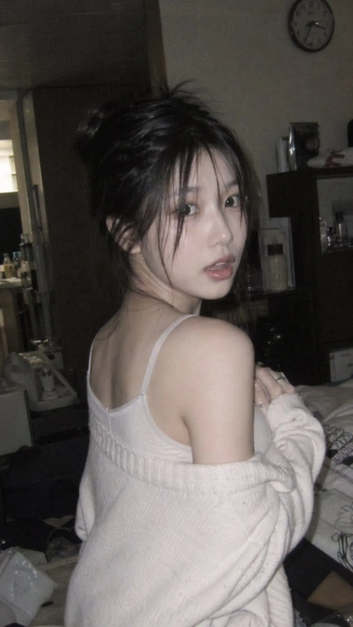 Candid Glance in Warm Bedroom