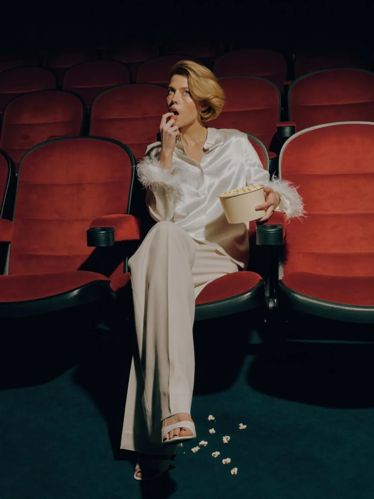 Elegant Fashion Editorial in Dark Movie Theater