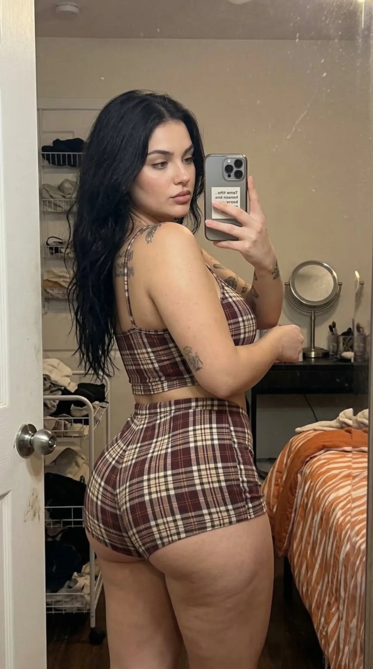 Mirror Selfie of a Young Woman with Tattoos - Curated Style